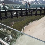 Visitors checking out the glass platform at Glacier Skywalk